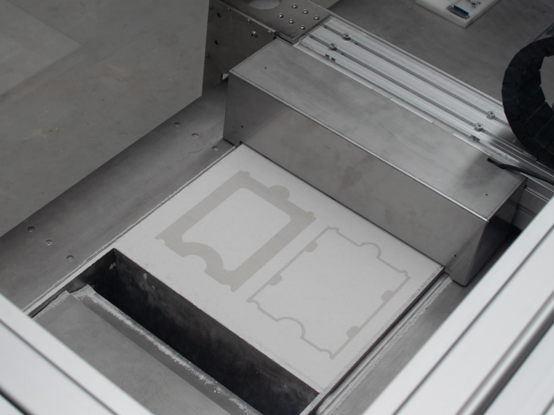 The Armadillo White 3D printer in operation